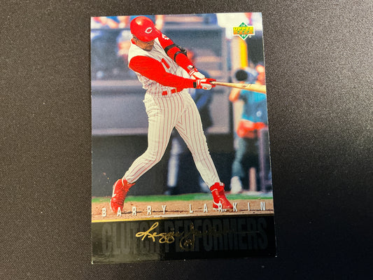 A 1993 Upper Deck Clutch Performers baseball card featuring Reds player Barry Larkin in mid-swing with a red and white striped uniform, signed by Larkin.
