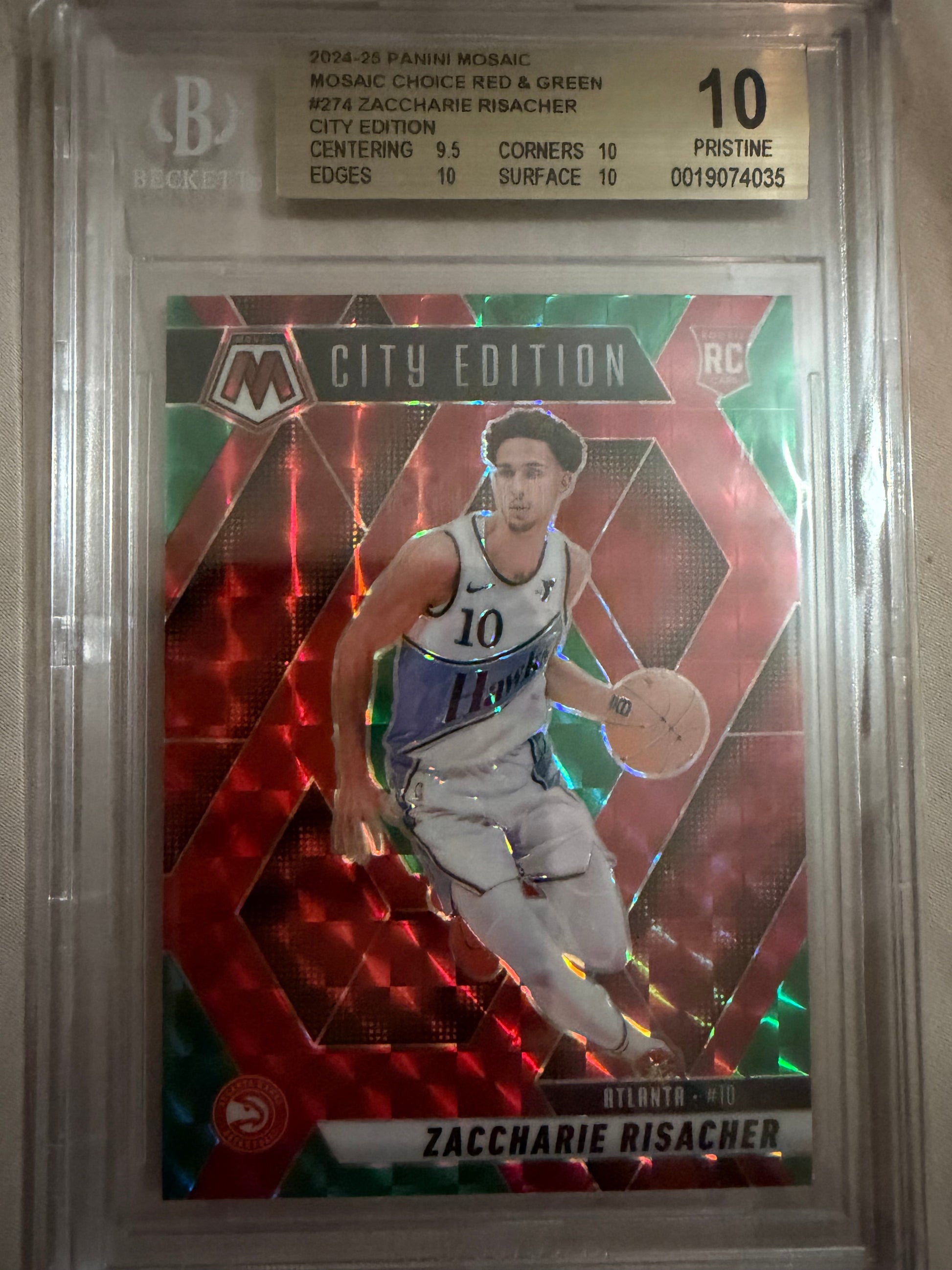 Basketball trading card with player image and text on a reflective surface