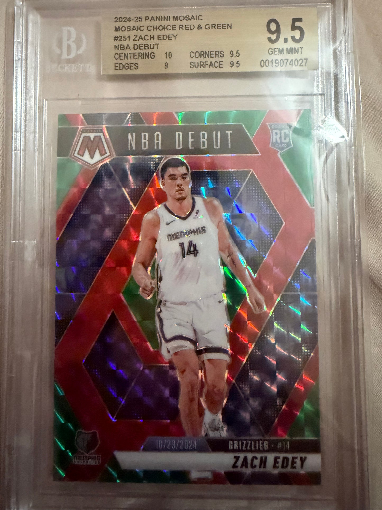 Basketball trading card with player image and 'NBA Debut' text, encased in protective plastic.