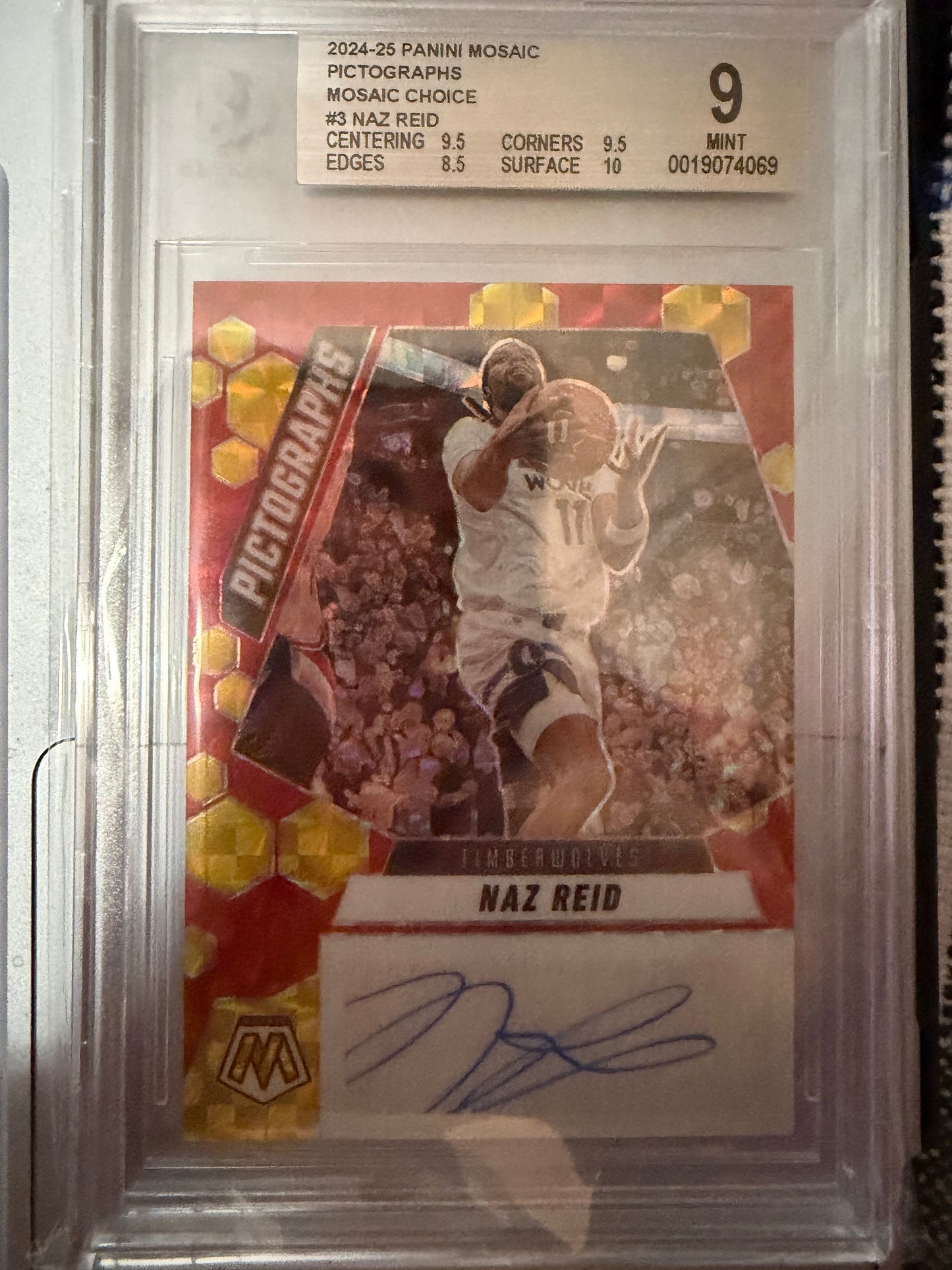 Trading card of a basketball player with a signature, encased in protective packaging.